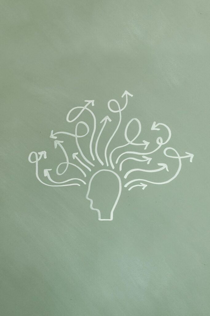 Illustration of a person's mind with thoughts and arrows representing the psychology behind why people take the Rice Purity Test