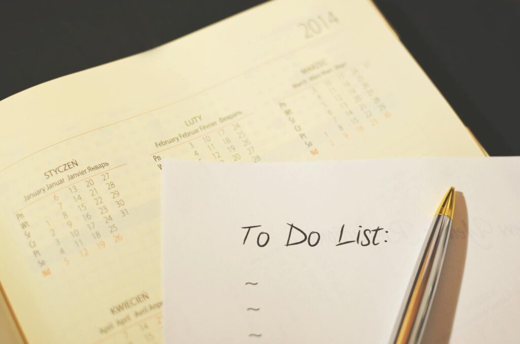 Pen on a to-do list checklist representing the 100 questions on the Rice Purity Test organized by category